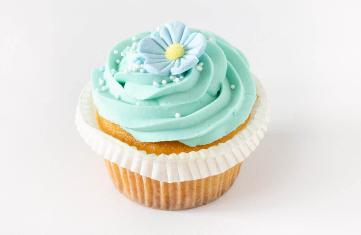 Bergen Kantinetjeneste - Vaniljecupcake med blå blomst
